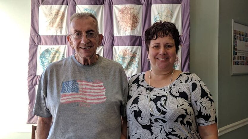 Photo of Janine and Hank inside of their home.