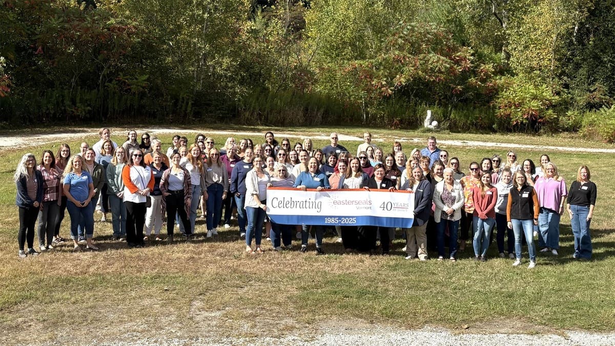 Easterseals VT staff pose for a group photo on the lawn of the Vermont Granite Museum as part of celebrating 40 years of impact